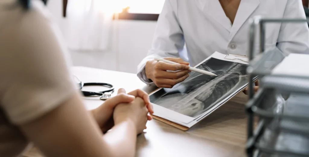 reviewing x-ray after a personal injury accident to determine medical costs and how much is owed in damages when a personal injury claim is filed