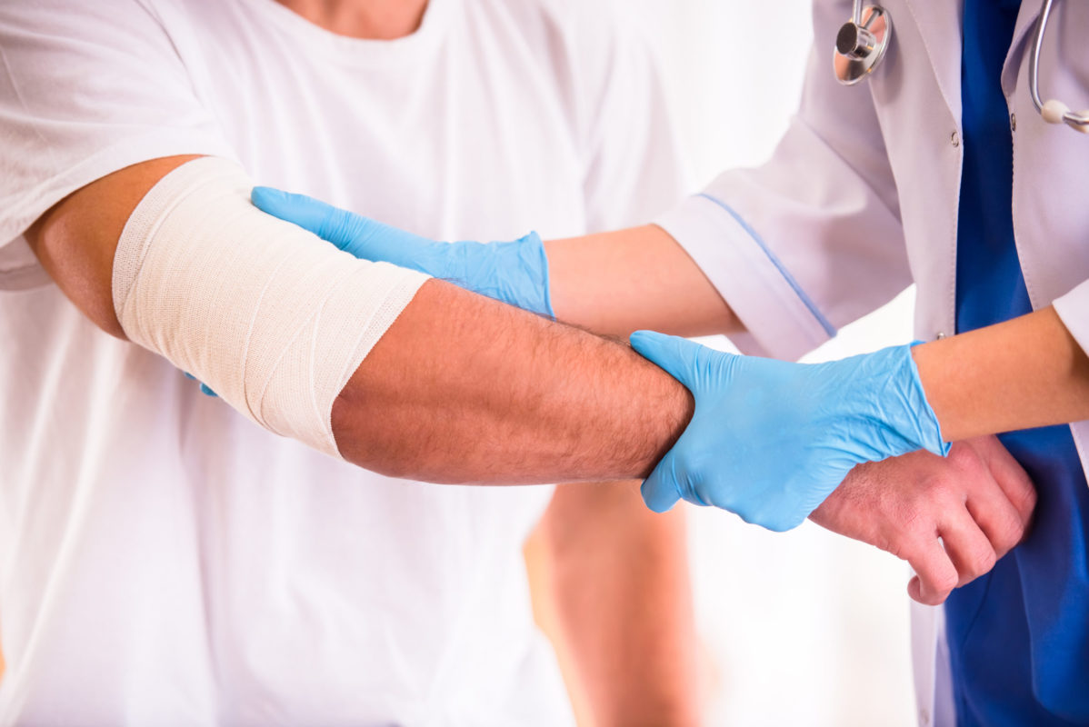 doctor examining injury