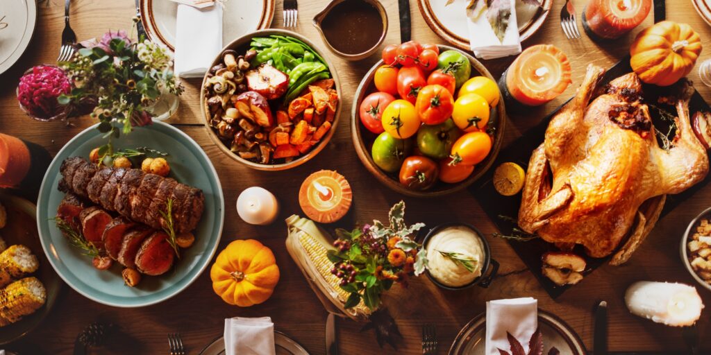 Thanksgiving meal with a turkey placed on the table, like the free turkeys from the Attorney Jeff Turkey Drive