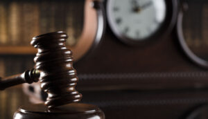 gavel and clock in background to represent the statute of limitations in California to file a personal injury claim for a car accident or other accident that causes injuries and damages