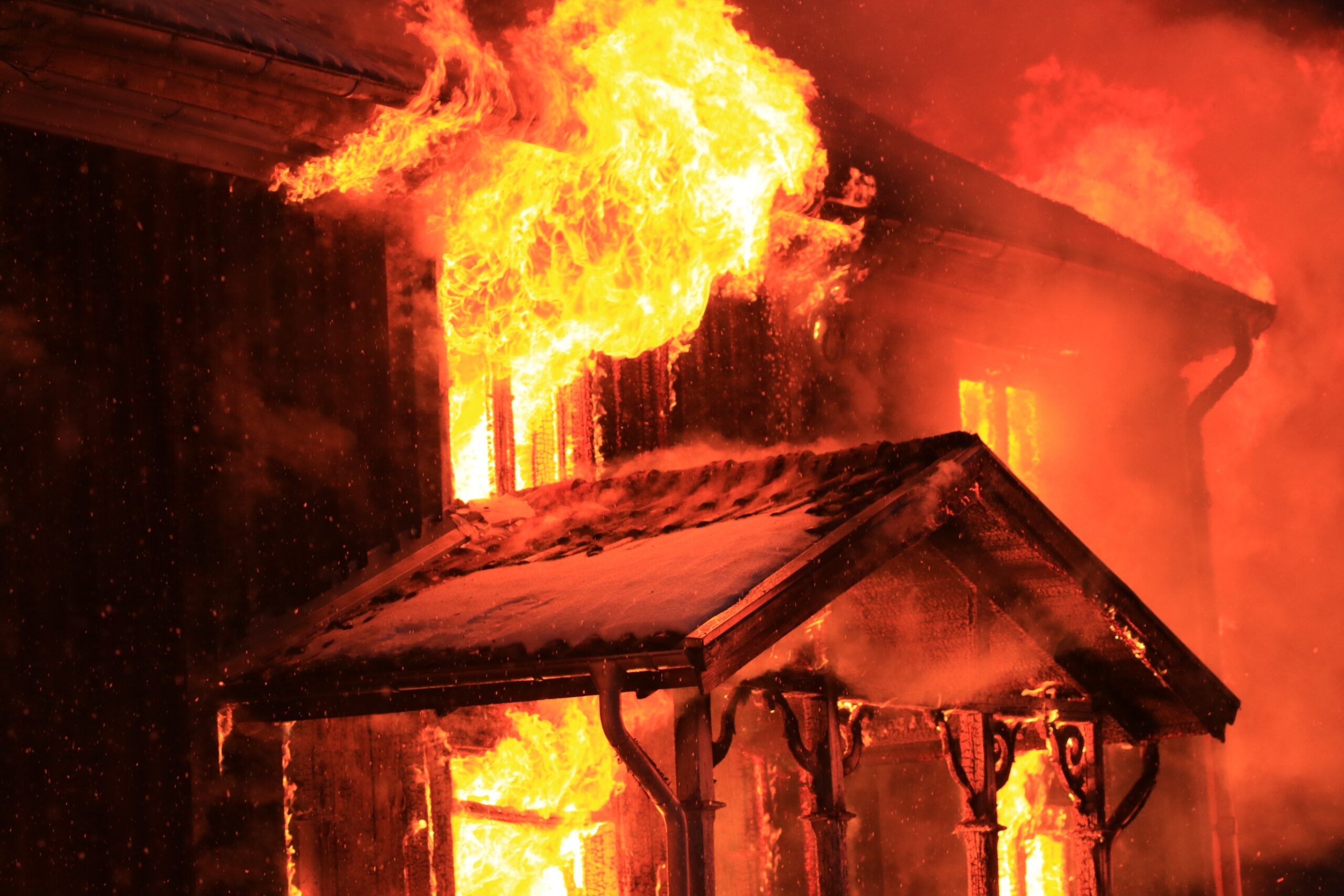 Home on fire due to wildfire or in-home fire that could have been prevented with fire safety awareness and prepared plan