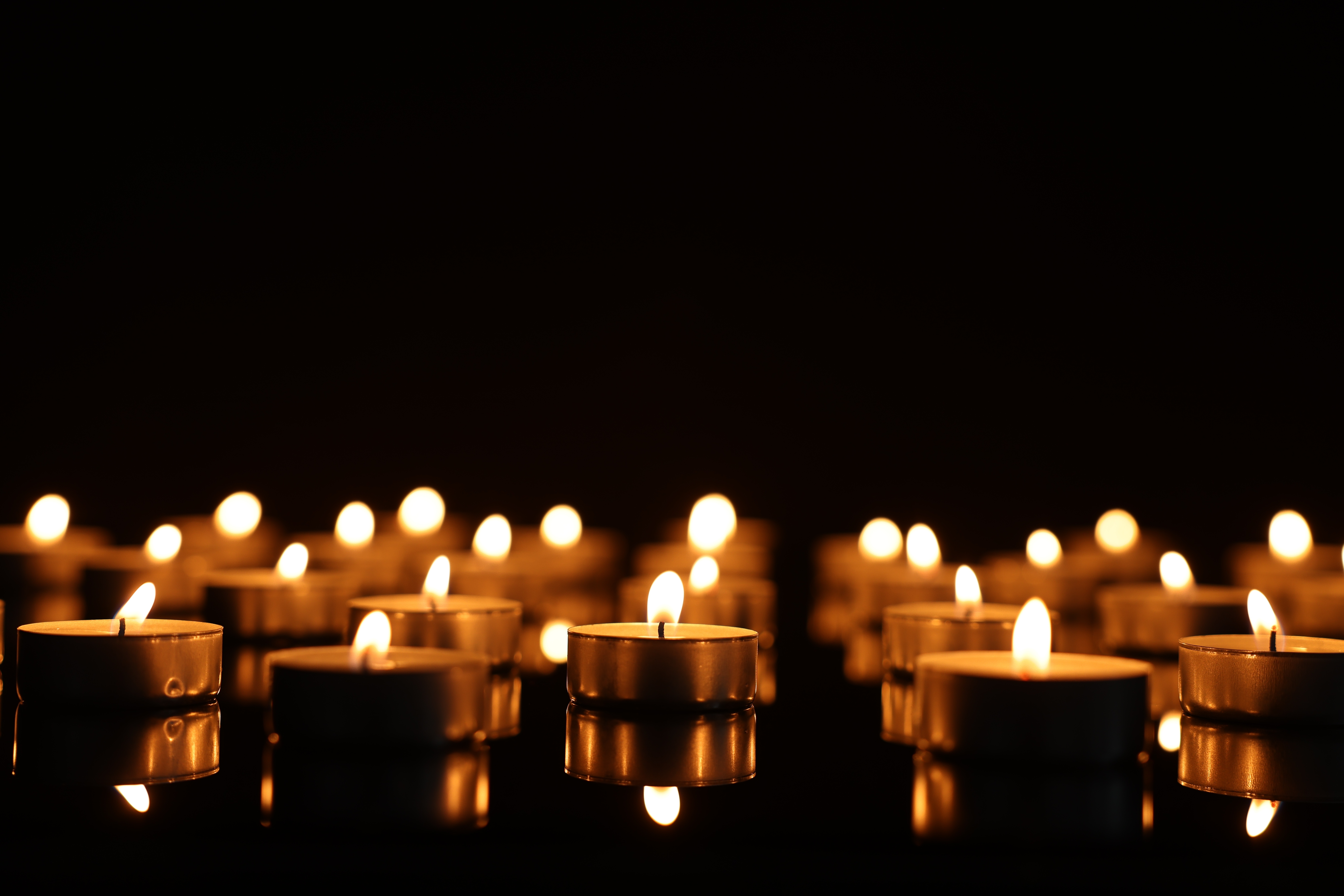 Candles at a memorial site to honor a family member whose wrongful death was caused by a negligent party.