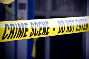 Crime scene tape placed by the police department during an investigation.